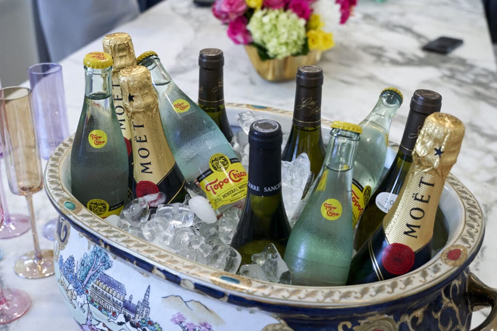 Bottles of champagne were uncorked by early afternoon. (Photo by Brian Hutson with Elevated Content)