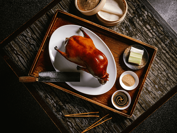 Mott 32 serves their signature duck carved tableside surrounded by old-world glamour so you feel like you’ve slipped into a Wong Kar Wai film.