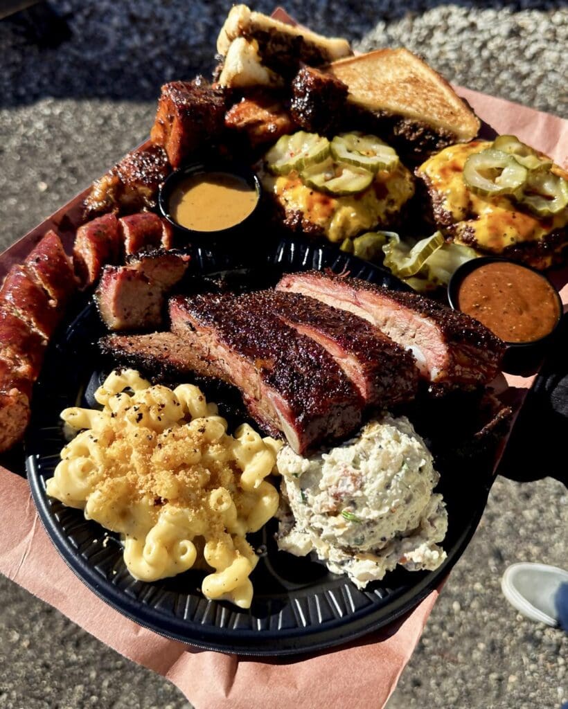 Brisket burgers, brisket, and more decorate trays at North Texas Smoke BBQ. (Courtesy)
