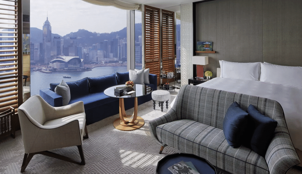The Deluxe Harbour Suites at Rosewood Hong Kong are positioned perfectly to watch ships glide across Victoria Harbor and catch the nightly 8 PM Symphony of Lights show that transforms the city's skyscrapers into a choreographed light display.