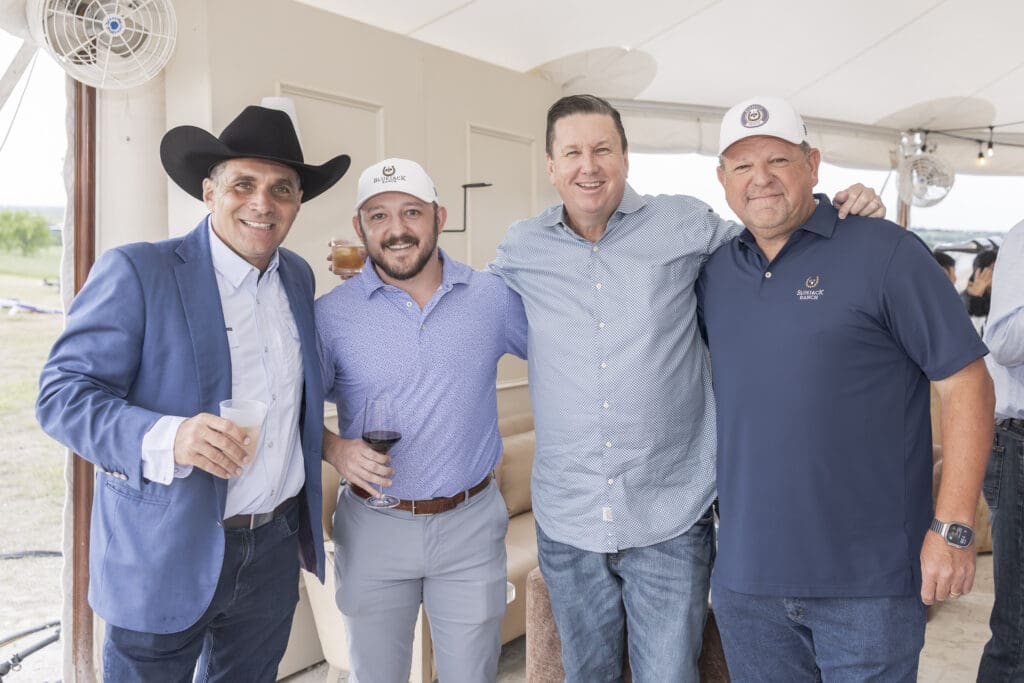 J.J. Henry (second from right) says construction is beginning to pick up for the private residential club that in the coming years will include around 580 homes. (Photo by Bluejack Ranch)