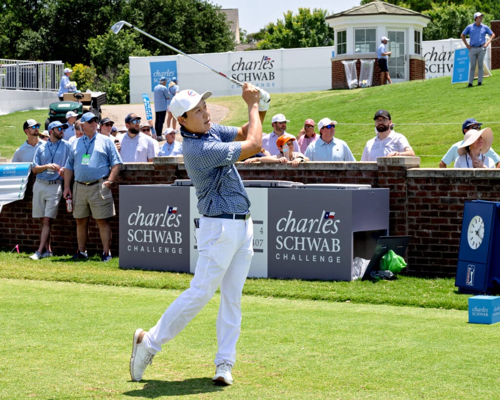 A competitor sends an iron shot flying down the 10th fairway in front of a full Saturday crowd. (Photo by Walt Burns)