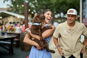 Zinat Ahmed with the chocolate labrador puppy, which she brought into her family after CrawFest; photo courtesy of Cotton Holdings, Inc. (Photo by courtesy of Cotton Holdings)