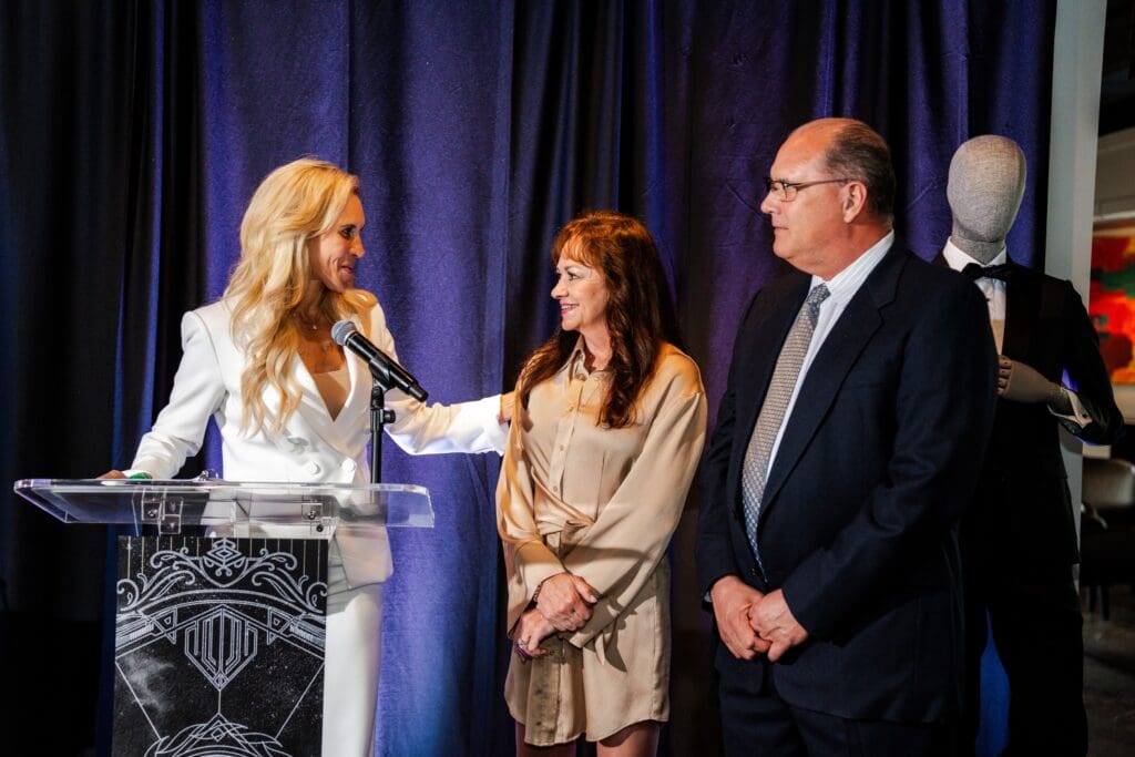 Missy Herndon stands with Carol and Todd Durkee, honorary chairs for The Walk in 2025. (Photo courtesy of Interfaith)