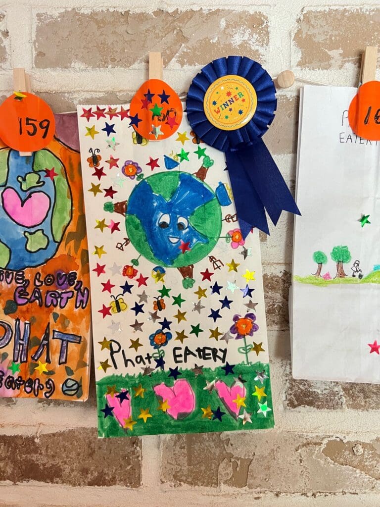 Maeunnun, a first grader at Lamar Elementary in Conroe ISD, designed this winning bag for to-go orders. (Photo courtesy Phat Eatery)