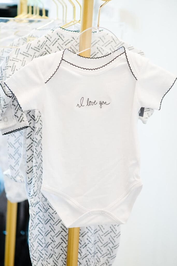 Angela Strong’s handwriting was digitized and used to create text featured on her Nestling Baby clothing line.  (Photo by Tara Flannery)