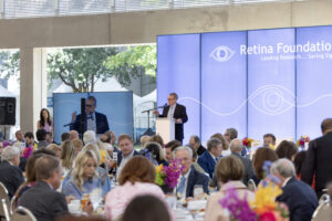 Jay Rosser, co-chair, speaking on stage (Photo by Sylvia Elzafon and Thomas Garza)