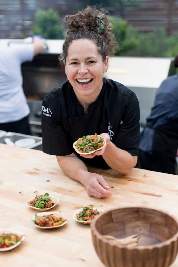 Chef Stephanie Izard made a memorable grilled pork belly with noodles and chili crunch bite for SAVOR. (Photo by Omni PGA Frisco Resort & Spa)
