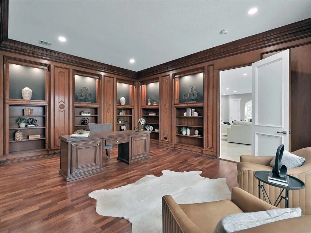 A paneled study with room for art displays is on the first floor just off the family room.