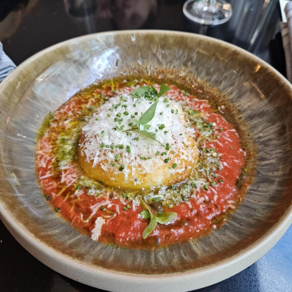 Duchess’s Fried Burrata blends rich cheese with bright tomato butter and a punchy citrus-olive relish. (Photo by Edward Brown)