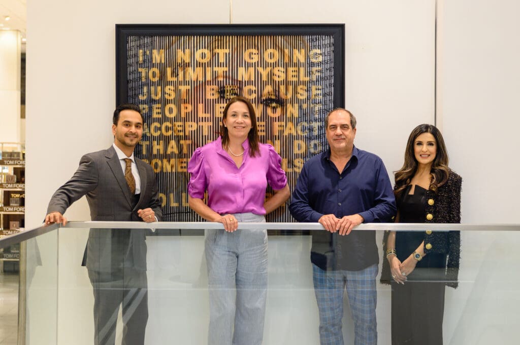 Paul & Tamatha Caldwell with Nick & Sneha Merchant and "Dolly Parton" art at Sneha Merchant exhibition at Neiman Marcus (Photo by Si Vo Photography)