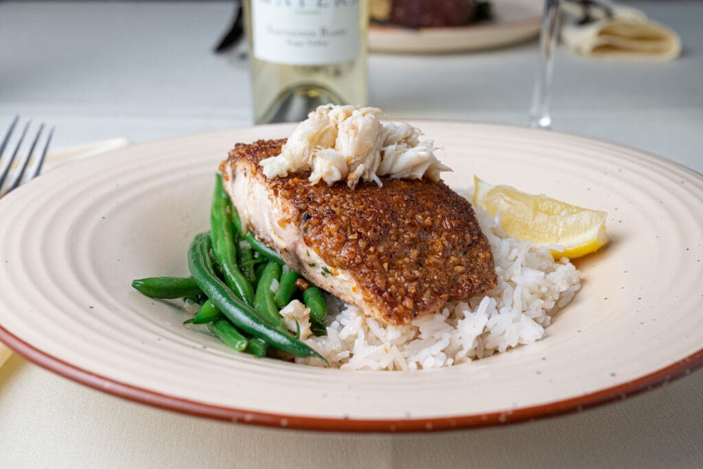 Bonnell’s pecan-crusted redfish, served with crab meunière and lemon-roasted Brussels sprouts, is a standout example of chef Jon Bonnell’s refined Texas cuisine. (Courtesy)