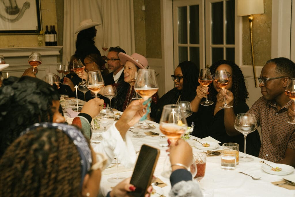 Guests raise their glasses to a wonderful evening at the Sips & Saddles: Supperclub Dinner at Hotel King David (Photo by NYC High Photography) 