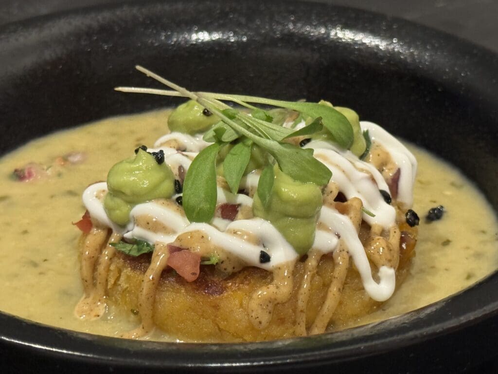 Del Frisco's Chef Edgar Morales created a sweet twice baked tamale cake with a creamed tomatillo sauce inspired by his Mexican roots. (Photo by Food and Vine Time Productions)