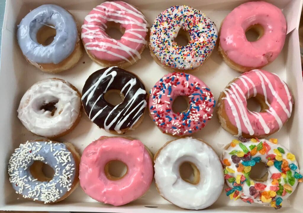 Operating since 1976, Duke’s Donuts keeps things classic with soft-glazed rings, sausage-stuffed kolaches, and retro curb appeal. (Courtesy)