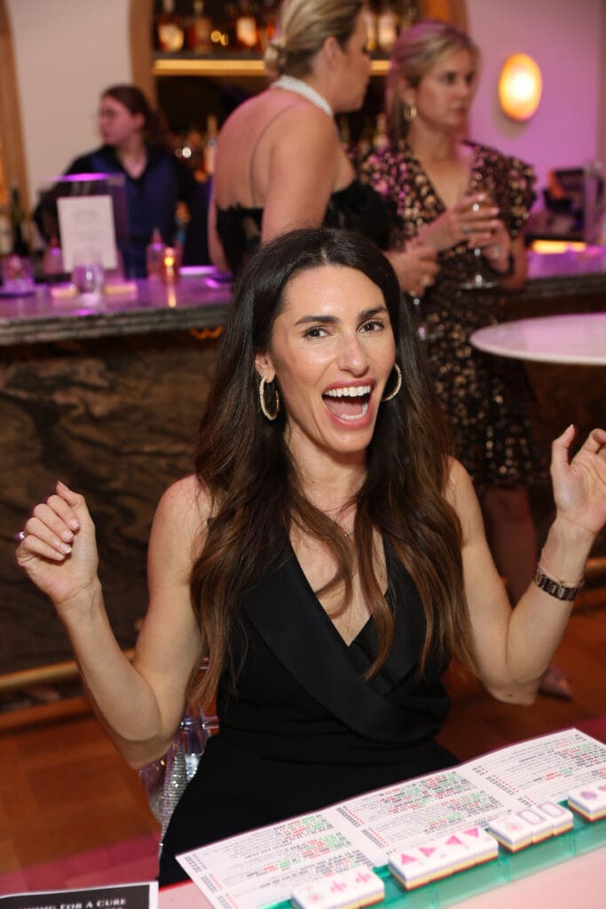Erin Kaplan celebrates a win at the Mahjong for a Cure soirée