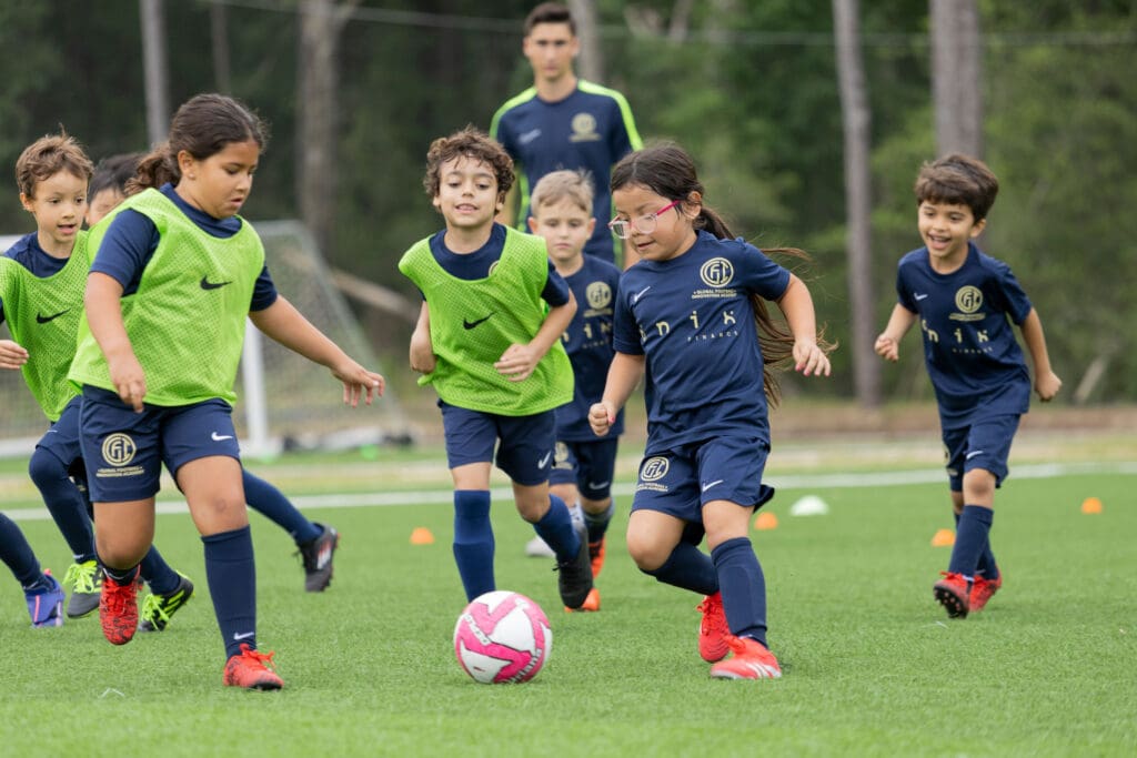 Boys and girls learn soccer skills in Houston’s Global Football Innovation programs. (Photo by Juanita Moreno)