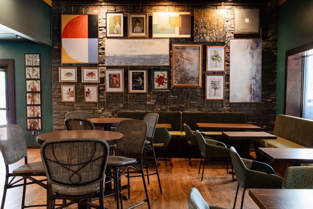 The 4,000 square foot space, designed by Gin Design Group, unfolds across three distinct interior and exterior zones: a moody, art-filled indoor bar wrapped in tile and brass accents, featuring a blend of mid-century modern and Southern Gothic influences; a covered, air-conditioned patio enclosed by French doors; and a sunny alfresco garden patio. (Photo by Photos by Becca Wright)