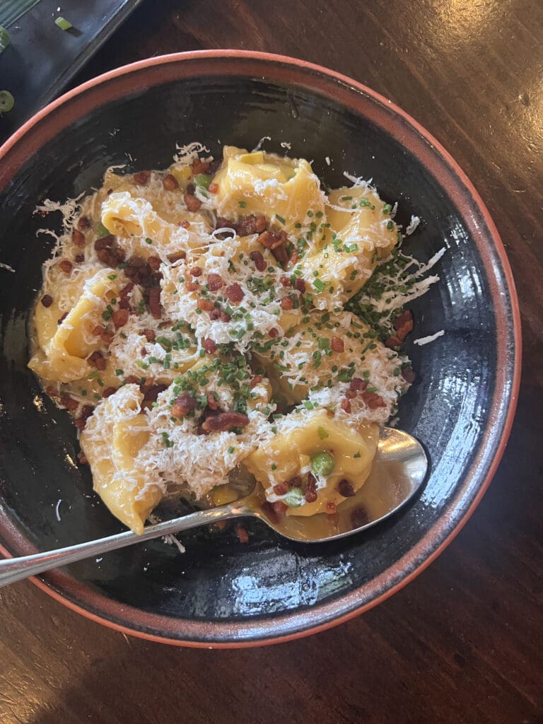 The dish everyone raves about lately at Buccan is the sweet corn agnolotti with ricotta, bacon, and espelette butter. It lives up to the hype. (Photo by Melissa Smrekar)