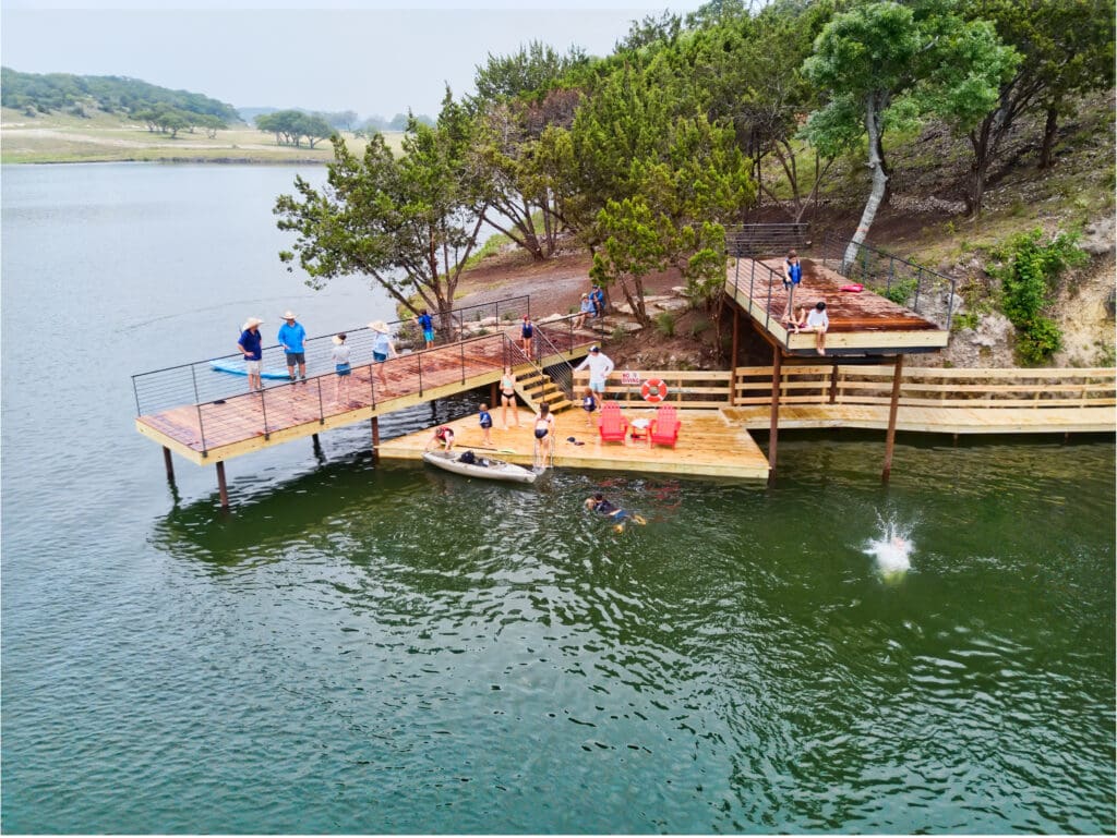 Gather with friends and family at the jumping platforms along Longhorn Lake. (Photo courtesy of Boot Ranch)