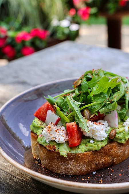 Press Cafe overlooks the Trinity Trails and draws crowds with its breezy patio, all-day hours, and polished but casual vibe. (Courtesy)