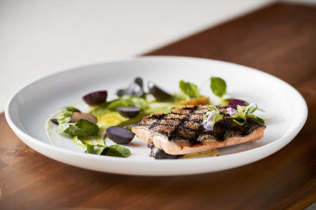 Locally-sourced cuisine reflects Wisconsin's agricultural heritage at the resort's signature restaurants.
