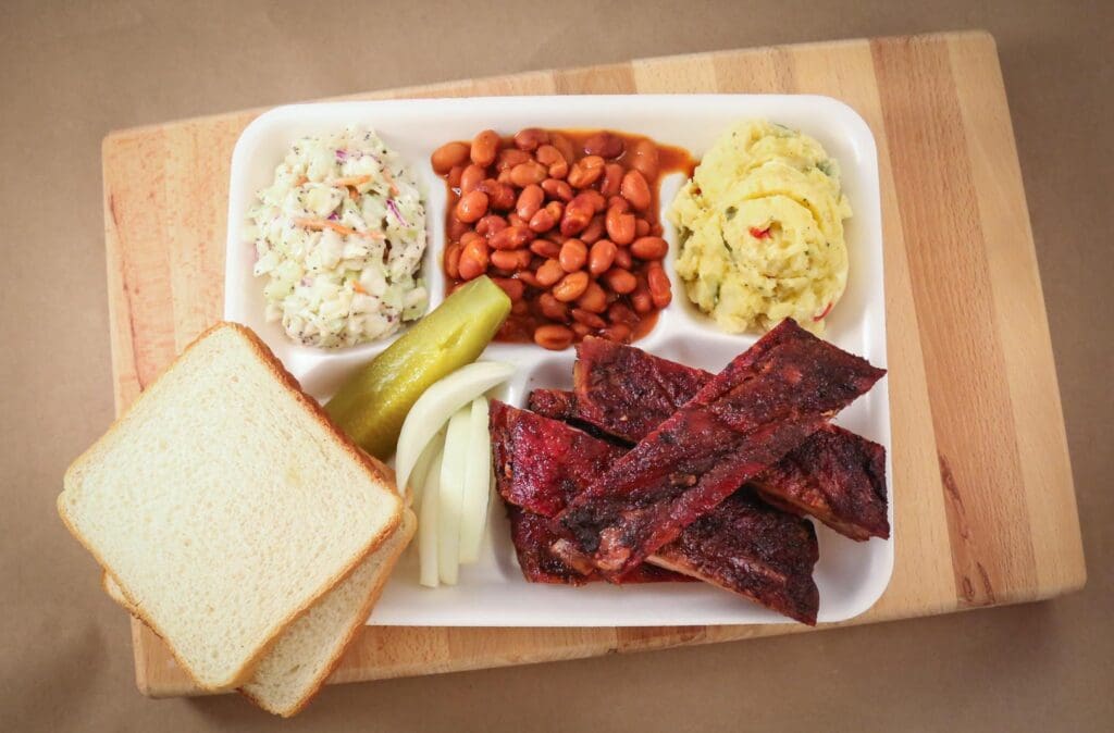 BBQ pairs well with ice-cold beer at Angelo’s Bar-B-Que. (Courtesy)