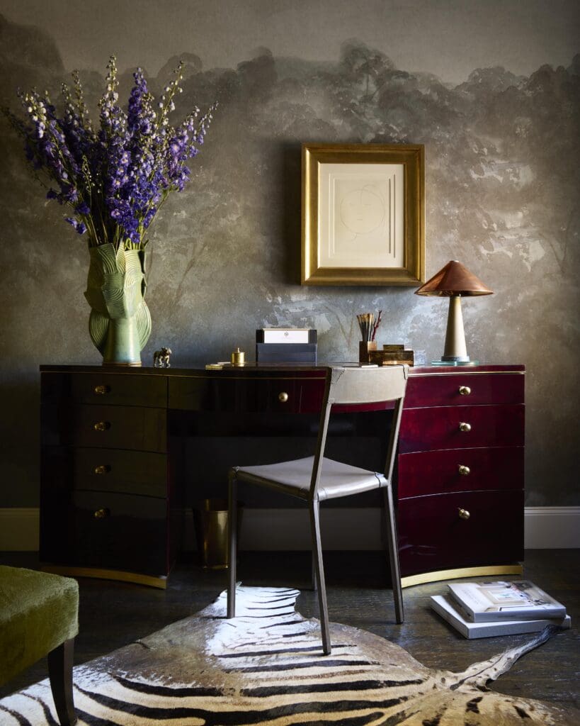 In the study, Moore originally designed the oxblood-color goatskin desk for Kips Bay Decorator Show House Dallas. Ochre chair. Bellagio wallpaper by Glamora. Collier Webb lamp. Picasso lithograph. (Photo by Kristopher Ellis)