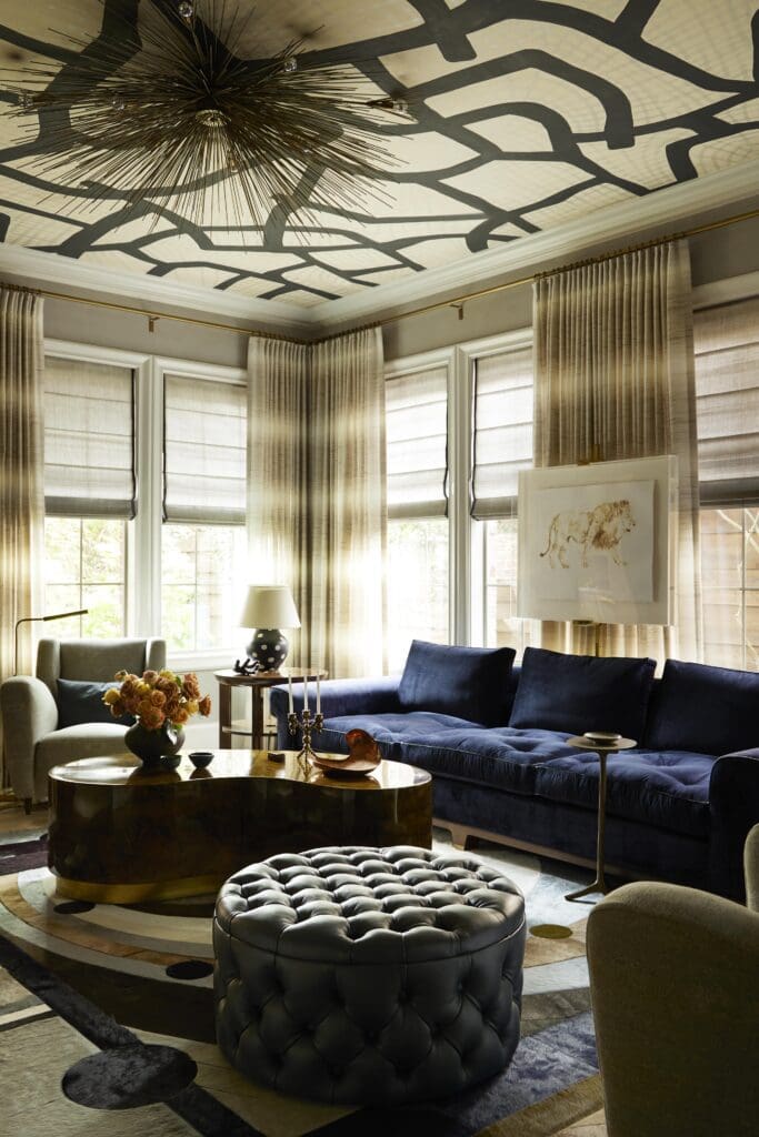 In the living room, Jennifer Noon polka-dot lamps, Porter Teleo hand-printed wallpaper on ceiling. (Photo by Kristopher Ellis)