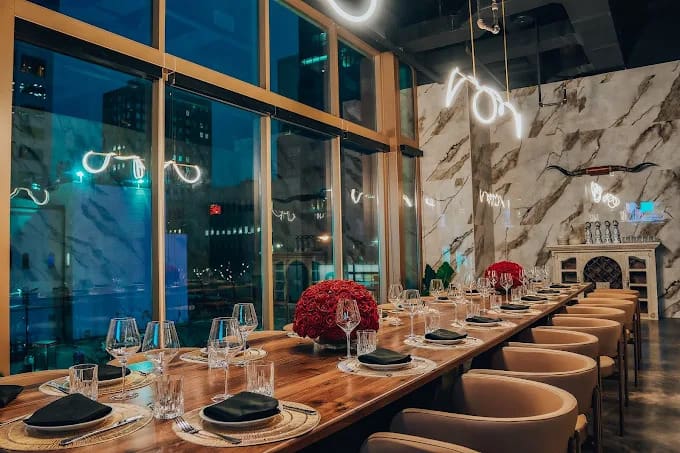 Polanco Fine Cuisine’s interior blends modern design with moody lighting and intimate table arrangements. (Courtesy)