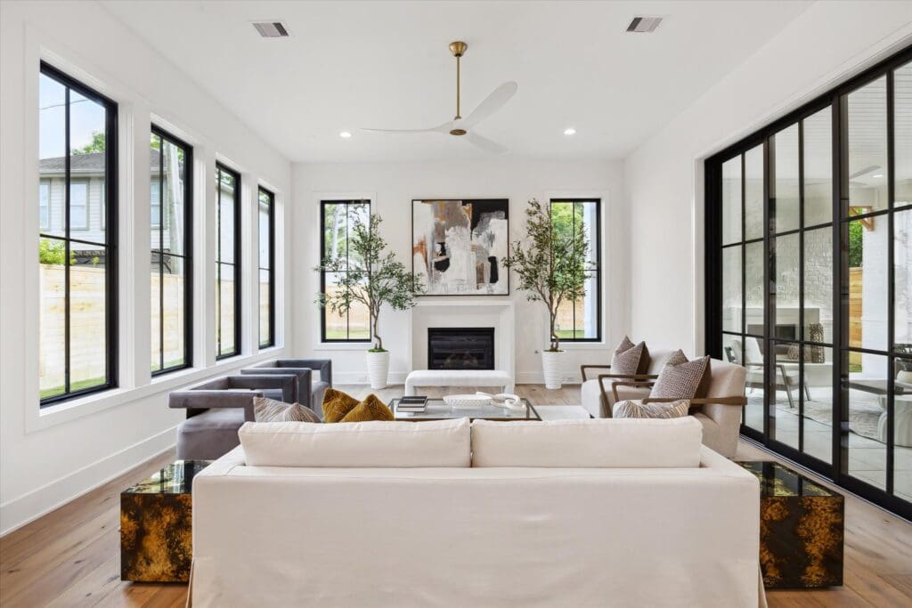 Twelve-foot ceilings and an abundance of windows were selling points of the home at 702 E. 19th Street (Photo by TK Images)