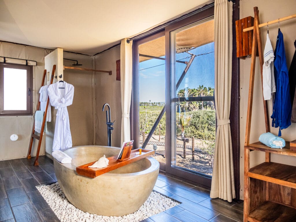 The Tented Ocean Suites are havens that offer important amenities like a plush king bed, air conditioning, Wi-Fi, a bathroom with a soaking tubs and rain shower