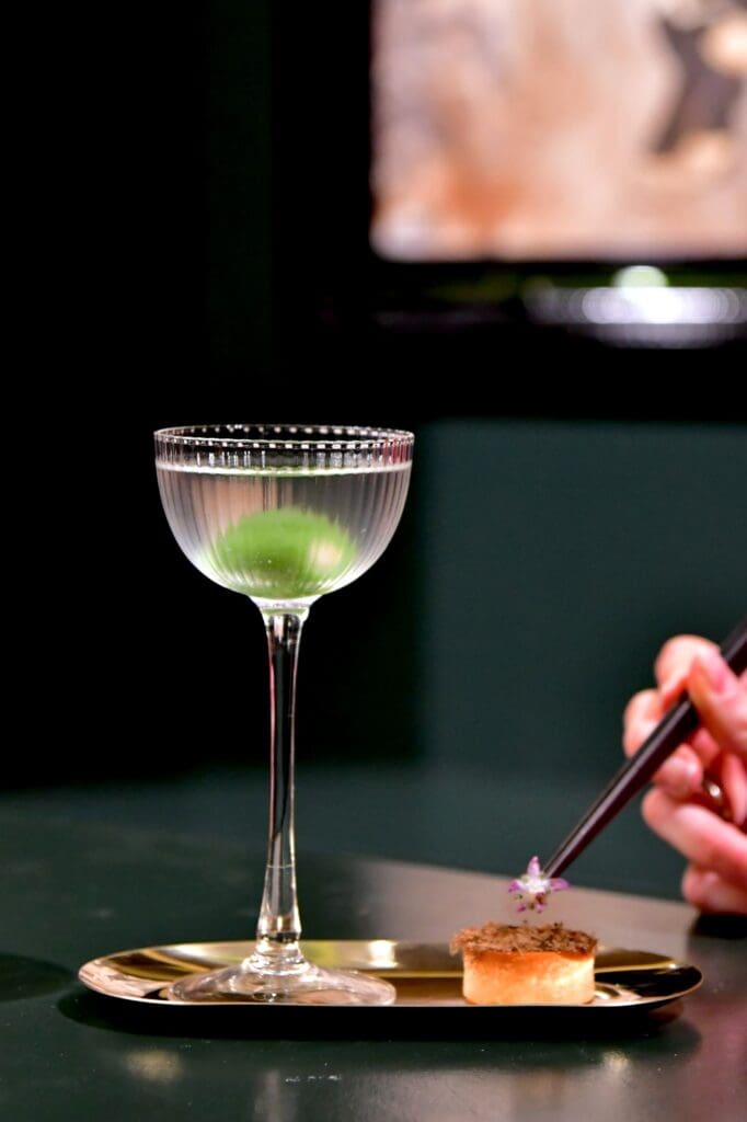 The Green Triangle, vodka mixed with peach yogurt and absinthe, served at the Navi speakeasy at The Post Oak Hotel (Photo courtesy of The Post Oak Hotel)