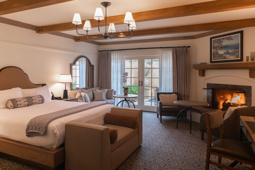 Each suite at Casa Palmero is designed with relaxation in mind, complete with a glowing hearth and private patio access.