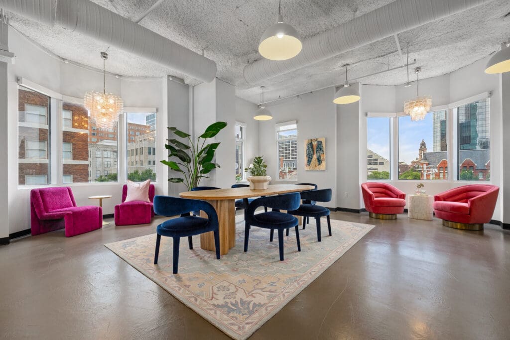 This cozy corner at The Maven in Sundance Square is filled with personality — from floral wallpaper to soft seating — offering a welcoming spot to unwind or connect. (Photo by LanCarte Commercial Real Estate)