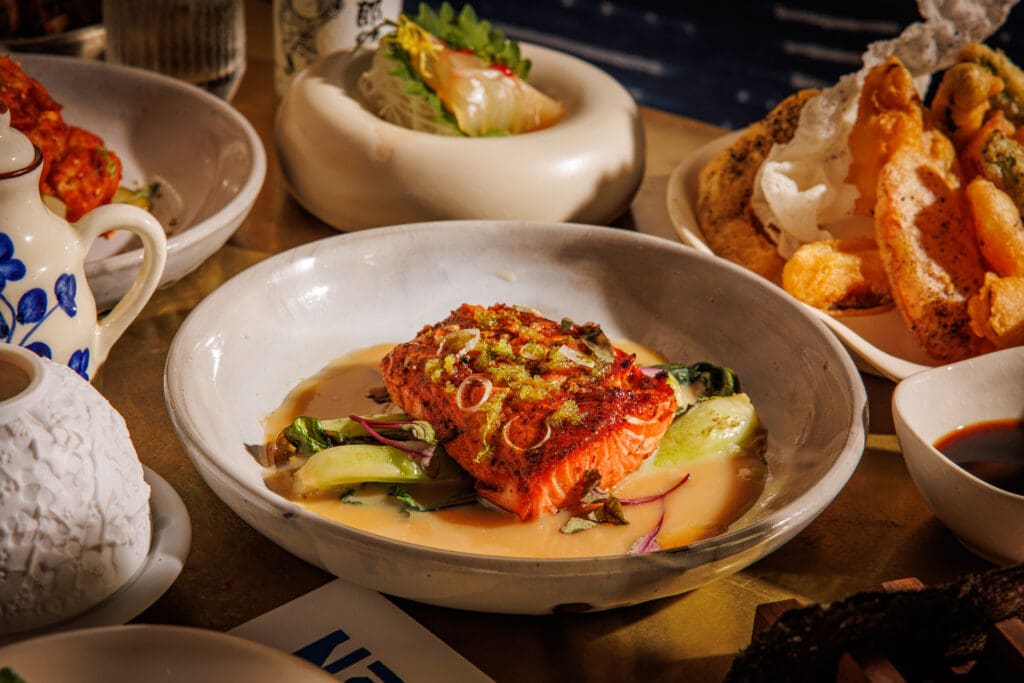 Guests can expect sashimi, handrolls, and nigiri from the raw program, balanced by skewers straight off the charcoal robata and larger cuts of meat from the hickory wood-fired grill at Norman's. (Photo by Samantha Marie Photography)