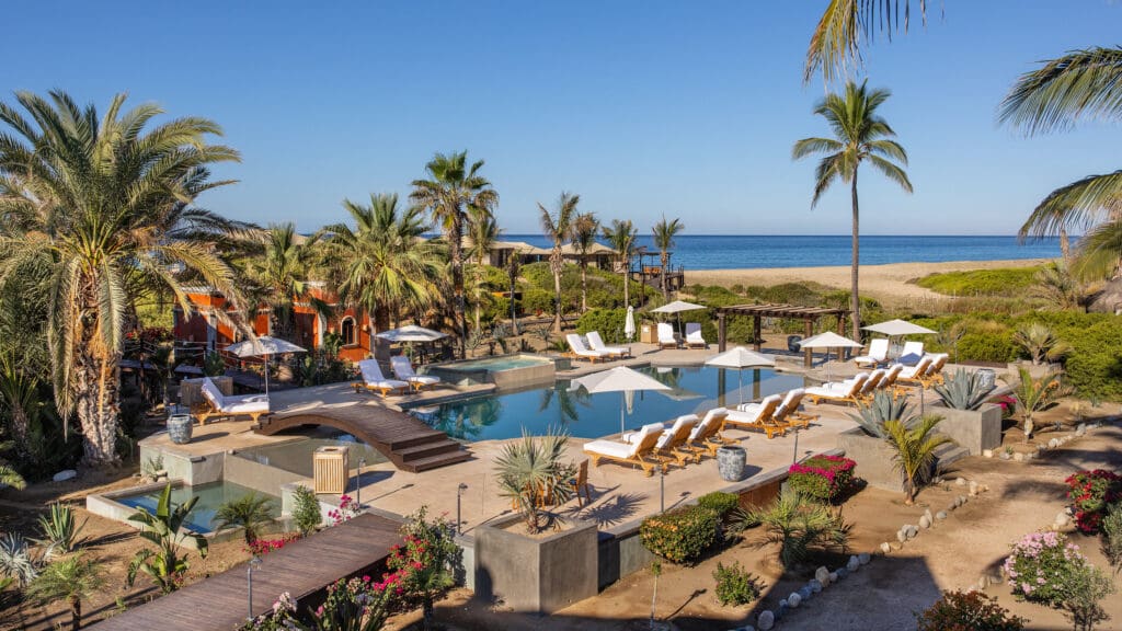 Two swimming pools anchor the property, one featuring a swim-up bar for socializing, the other an adults-only infinity pool for tranquil moments. 