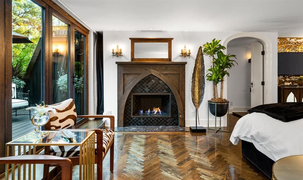 The primary suite feels particularly resort-like with its oversized shower featuring a steam unit and gas fireplace. (Photo by Allie Beth Allman & Associates)