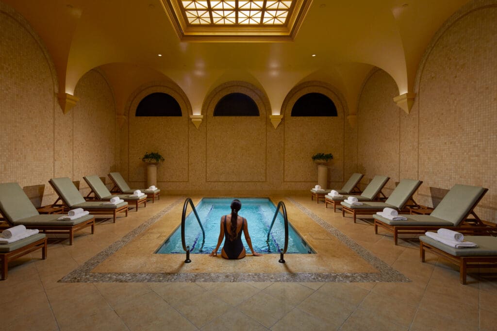 The 23,000-square-foot spa includes a Roman-inspired Acqua Colonnade, with a 28-foot-high Palladian rotunda, wall of flowing water, steam rooms, saunas, and saltwater soaking tubs. (Photo by The Resort at Pelican Hill)