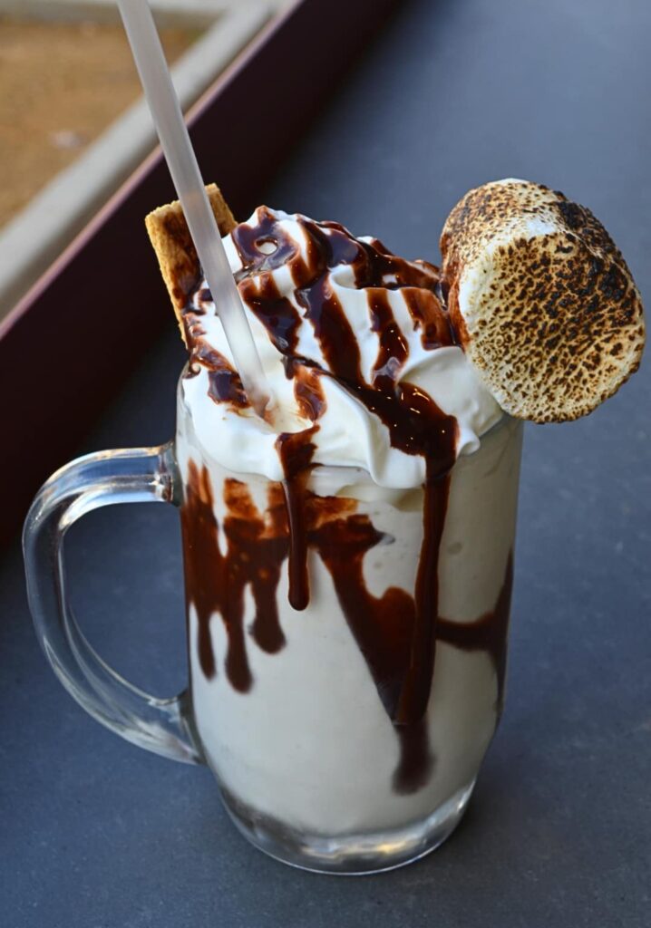 Jon’s Grille serves up boozy milkshakes and fruit-forward cocktails like the Blackberry Sage Tea with mint and lemonade. (Courtesy)