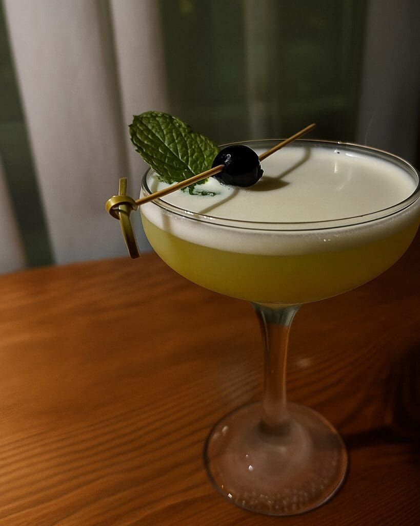 Proper’s Yokai Jinn Sour mixes vodka, yuzu curaçao, Midori, mint, and lime for a citrusy cocktail with a silky finish. (Courtesy)