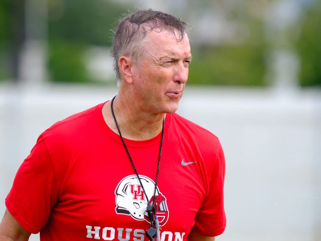 University of Houston football coach Willie Fritz puts in plenty of work during a summer practice. (Photo by F. Carter Smith)