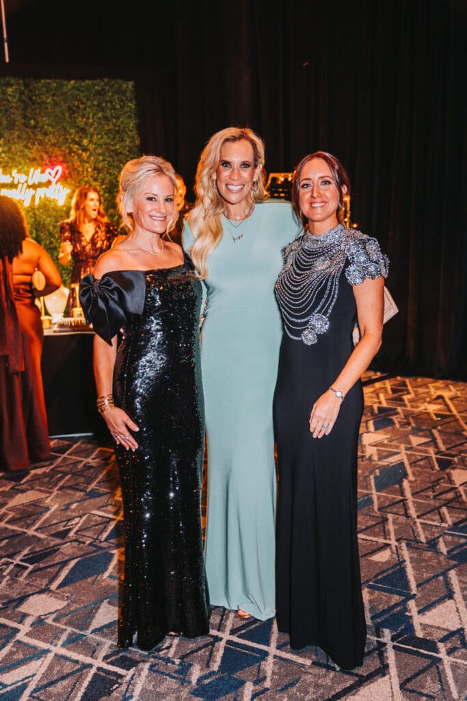 The Walk was chaired by Carrie Greenberg and Kristen Byrnes. Interfaith CEO Missy Herndon joined them at the gala at The Woodlands Waterway Marriott. (Photo by Interfaith of The Woodlands)