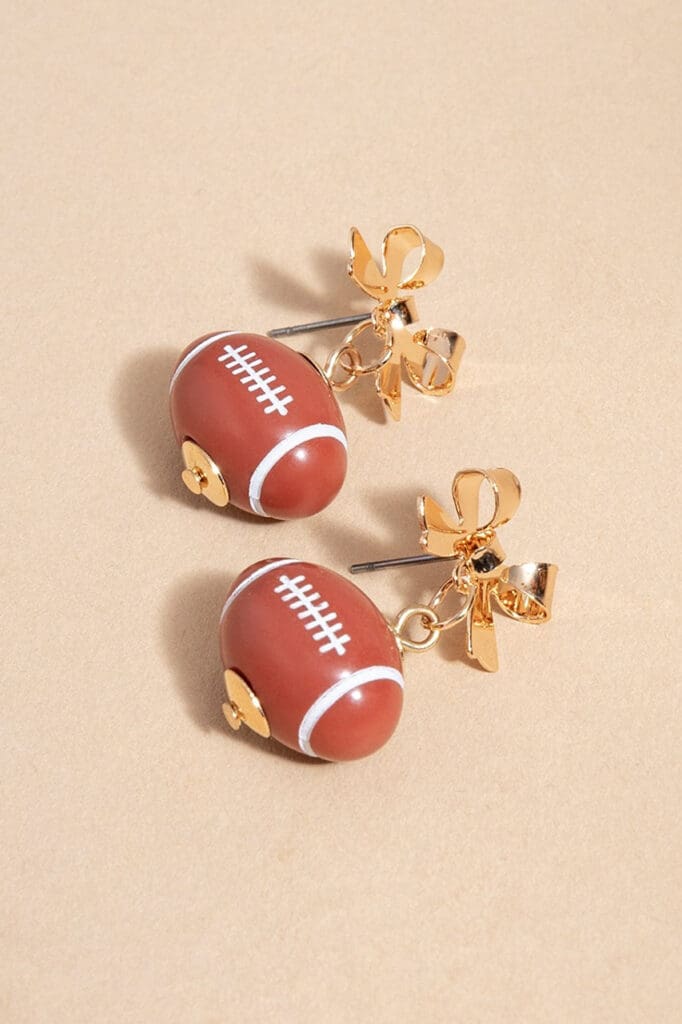 These adorable football bow earrings from Francesca's are the perfect statement piece for the season. (Photo courtesy of Francesca's) 