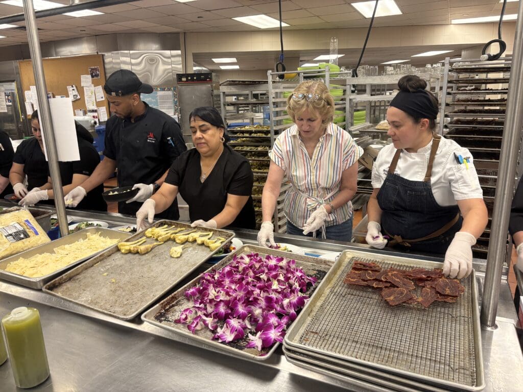 Salads are plated by Marriott staff in the hotel kitchen a few hours before the event. (Photo courtesy The Woodlands Waterway Marriott)