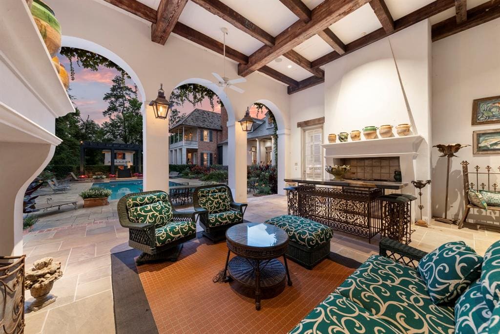 Enjoy a serene backyard oasis in this beautiful outdoor living area.