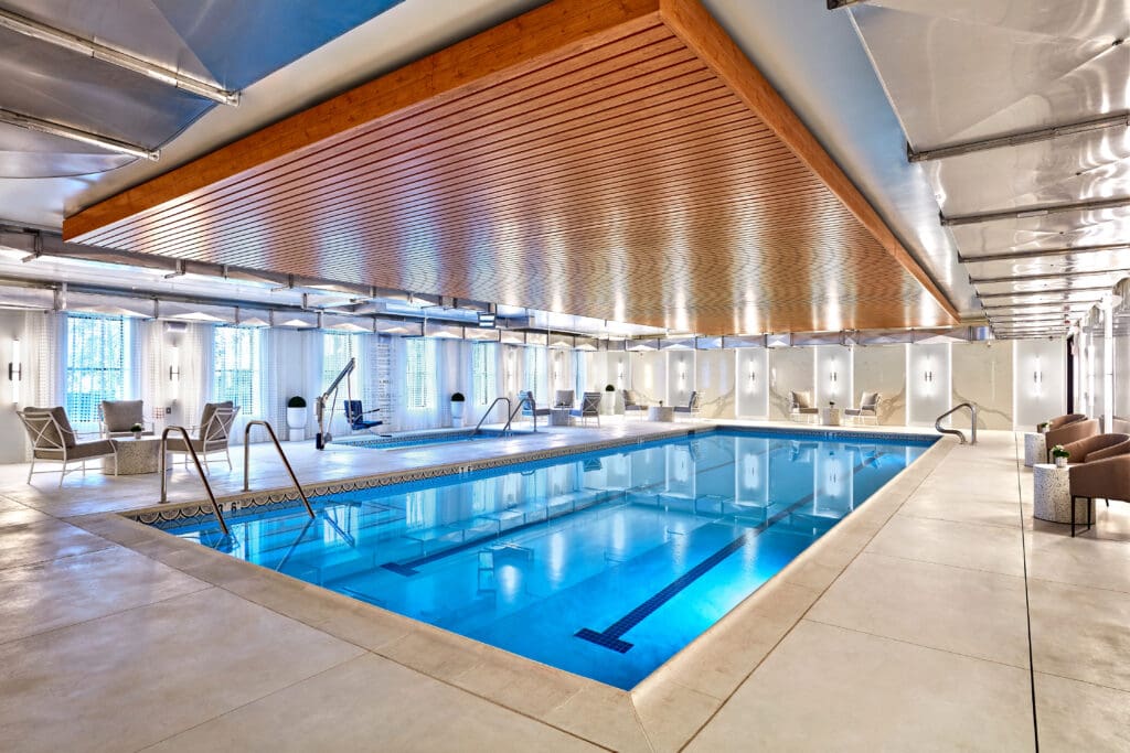 Amenities include everything from a family party room to a bowling alley, indoor saline pool, sports lounge, golf simulator, library, movie theater, "opulent" beauty salon, and an art studio, in addition to an on-site doctor's office, a state-of-the-art fitness center, and a Pilates studio. (Pictured here is Vivante Newport, Courtesy Nexus)