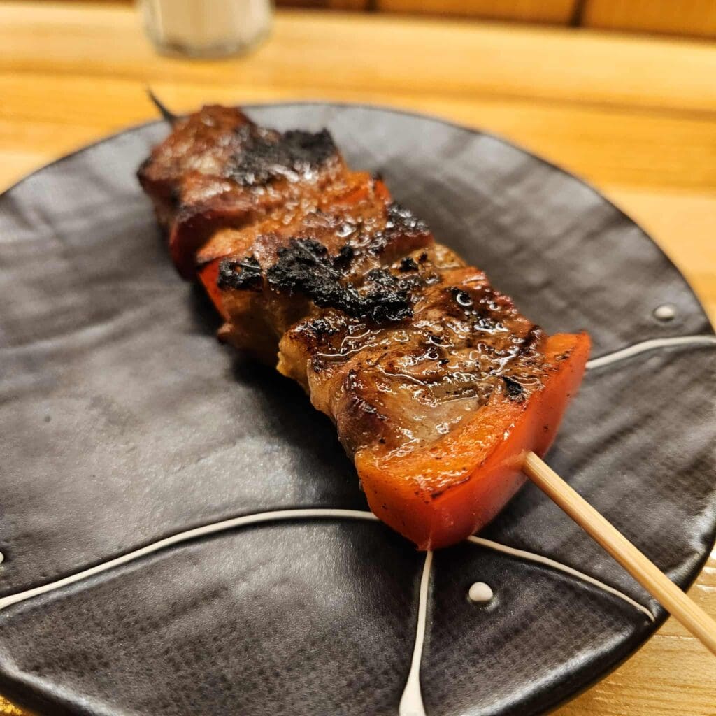 The sweet soy–marinated ribeye at Ichiro Izakaya Yakitori Diner and Bar comes out sizzling. (Photo by Edward Brown)