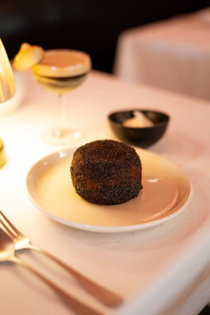 The Smoked Tea Donut at Le PasSage is a warm brioche donut served with burnt cinnamon sugar and Lapsang Souchong Sabayon. (Photo by Beckley)