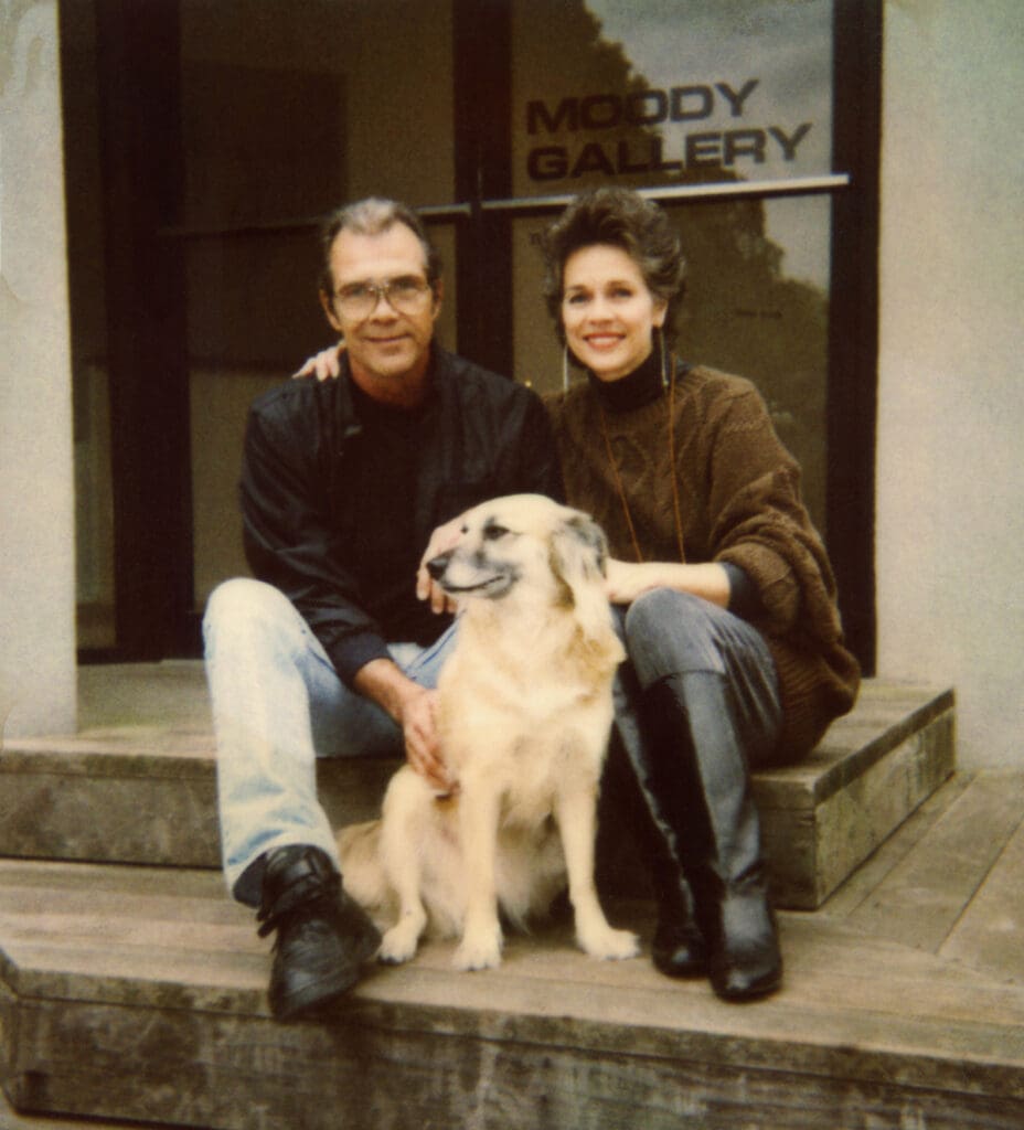 Bill Steffy, Betty Moody and Babe the gallery dog stand in front of the entrance to Moody Gallery in 1995. (Photo courtesy Moody Gallery)